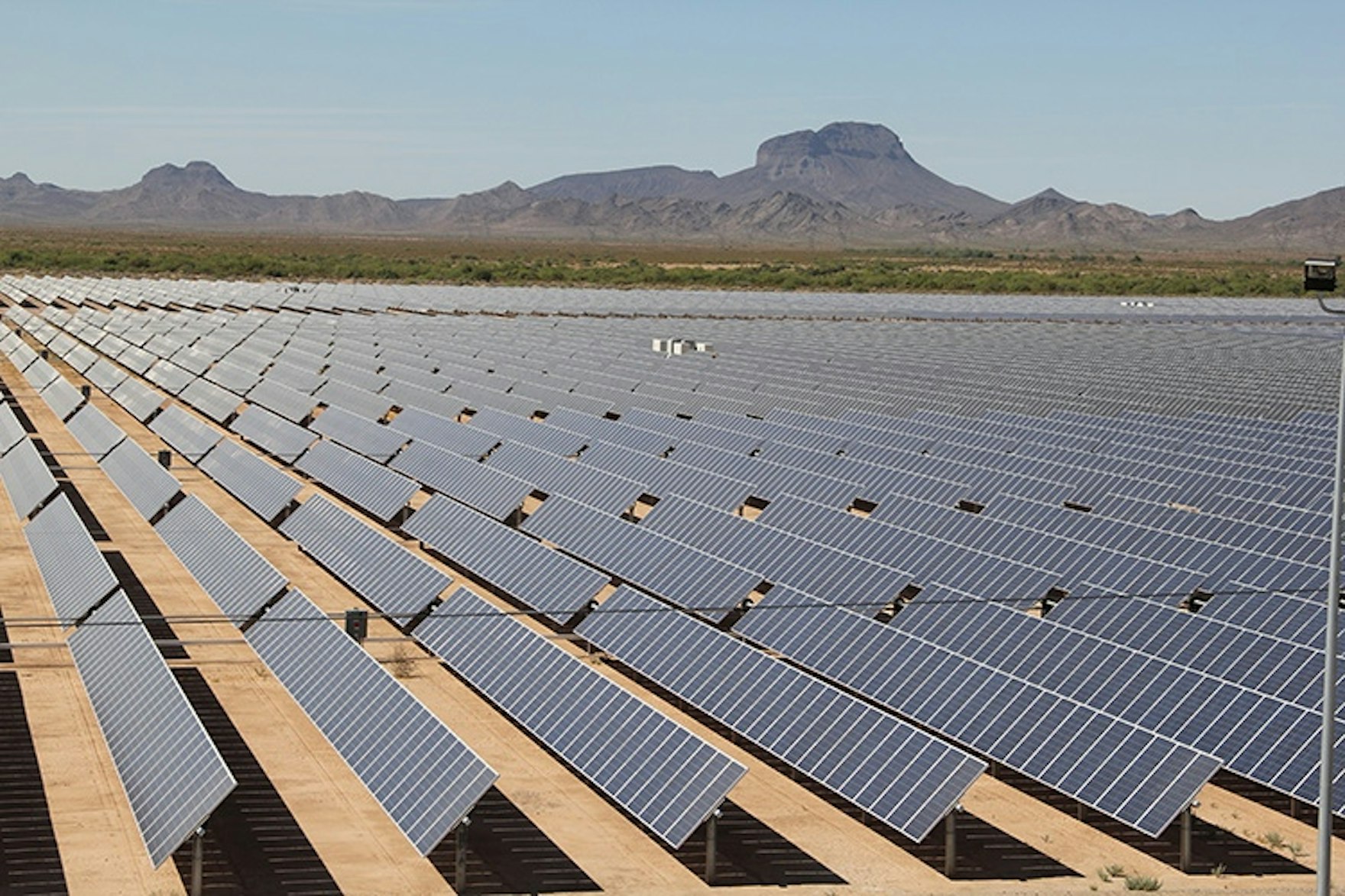 Solar panels with moutains in background